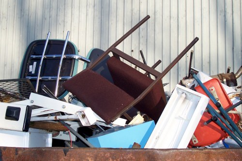 Workers carrying office furniture down stairs in a terrace office